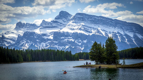 Scenic view of lake with mountains in background