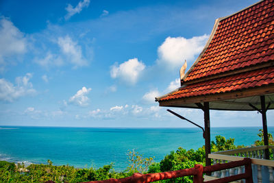 Scenic view of sea and building against sky