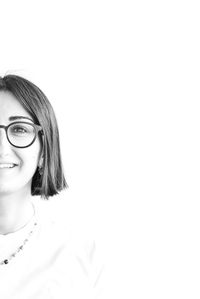 Portrait of a smiling young woman over white background