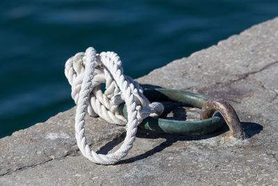 Close-up of rope tied on metal