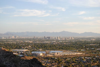 Cityscape with mountain range in background