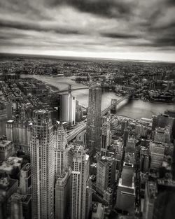 Cityscape against cloudy sky