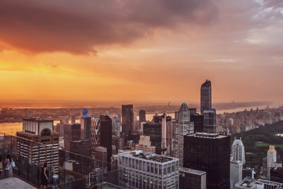 High angle view of buildings against sky during sunset