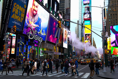 People walking on street in city