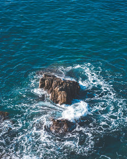 High angle view of rock formation in sea