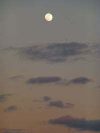 Low angle view of moon against sky at sunset