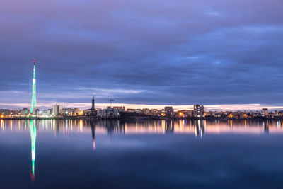 Long exposure photo of a beautiful sunset at lacul morii lake with urban buildings in the background