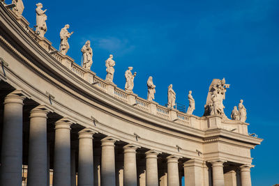 Low angle view of statue against blue sky