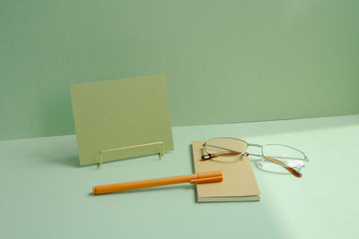 Directly above shot of blank book with books on table