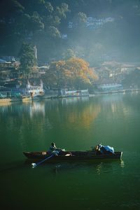 Man rowing boat on lake