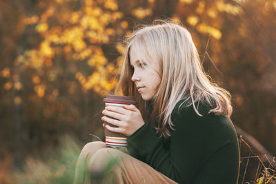 Young woman drinking coffee