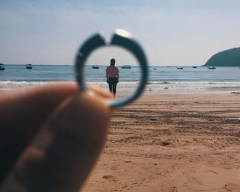 Man on beach against sky