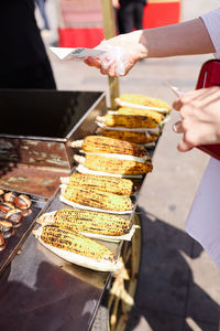 Cropped hand of person preparing food