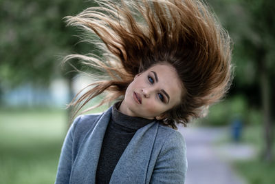 Portrait of young woman outdoors