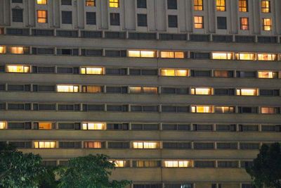 Low angle view of illuminated building at night
