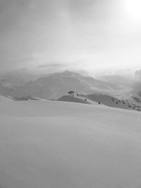 Scenic view of landscape against sky during winter