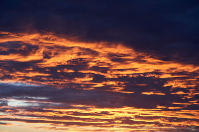 Low angle view of clouds in sky during sunset