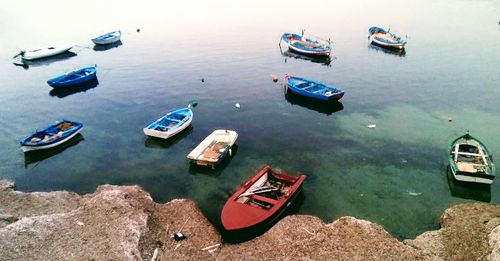 High angle view of boats moored at harbor