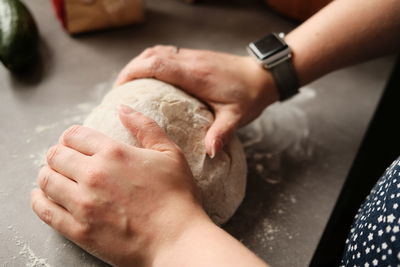 Cropped hands of person preparing food