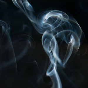 Close-up of smoke against black background