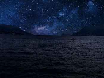 Scenic view of sea against sky at night