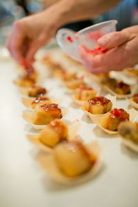 Cropped hand preparing food