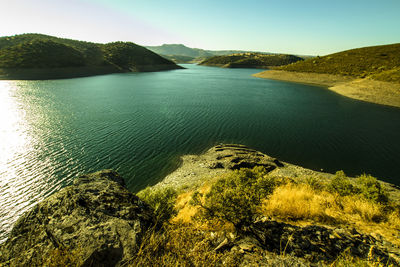 View of calm lake against mountain