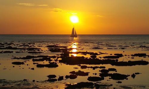 Scenic view of sea against sky at sunset