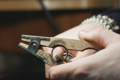 Close-up of man with cigar cutter