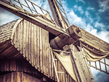 Low angle view of wooden windmill