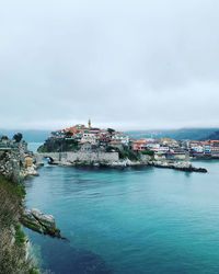 Scenic view of sea by buildings against sky in amasra, turkey