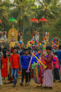 People dancing in multi colored umbrellas