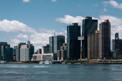 Modern buildings in city against sky