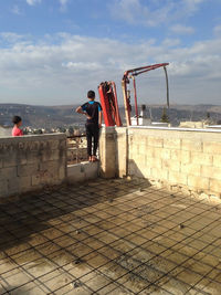 People standing against the wall