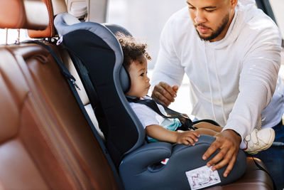 Father and son in car