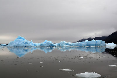 Scenic view of frozen sea against sky