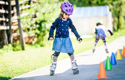 Girl skating on road