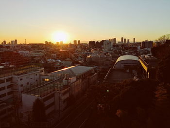 High angle view of buildings against sky during sunset