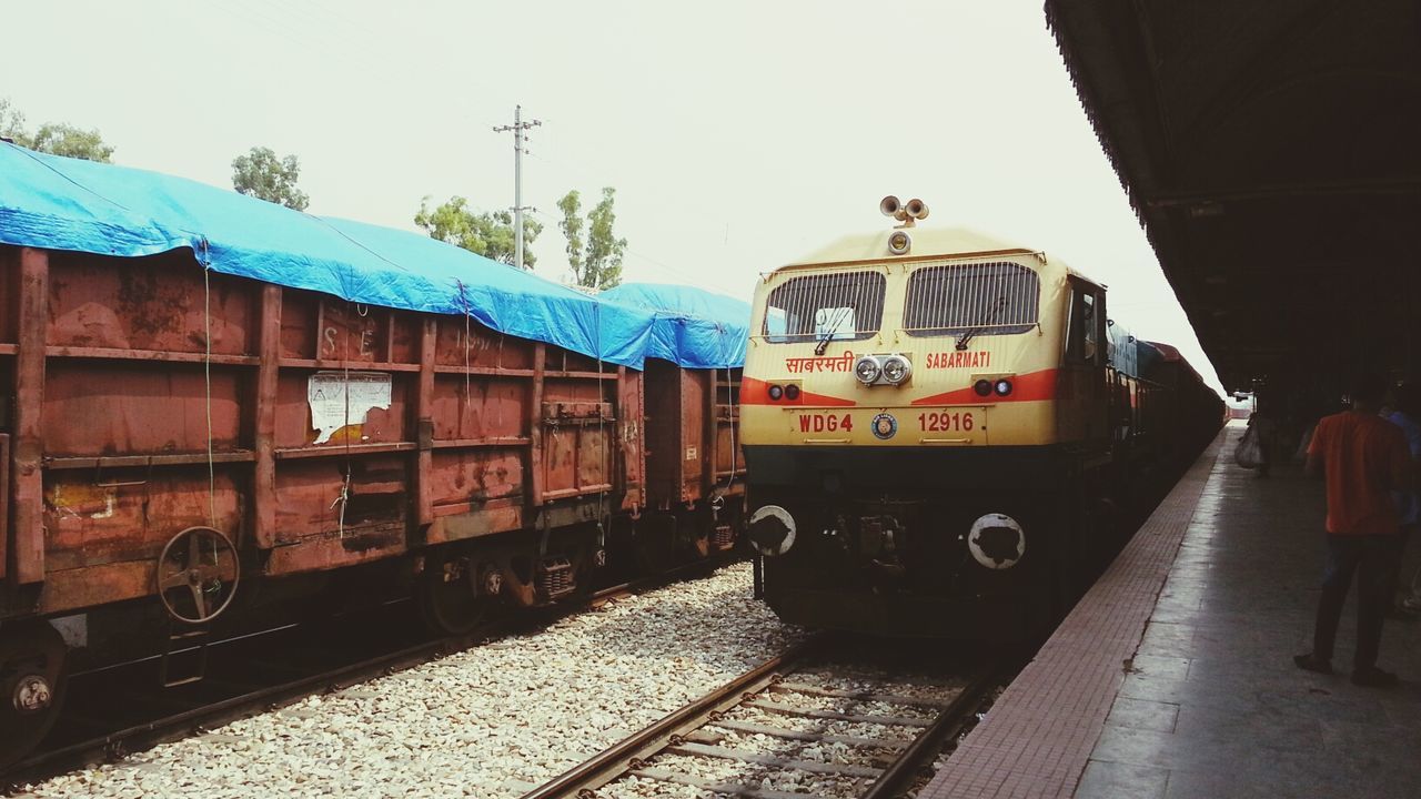 transportation, railroad track, rail transportation, public transportation, train - vehicle, mode of transport, railroad station, clear sky, railroad station platform, built structure, architecture, building exterior, travel, passenger train, land vehicle, day, outdoors, train, winter, snow