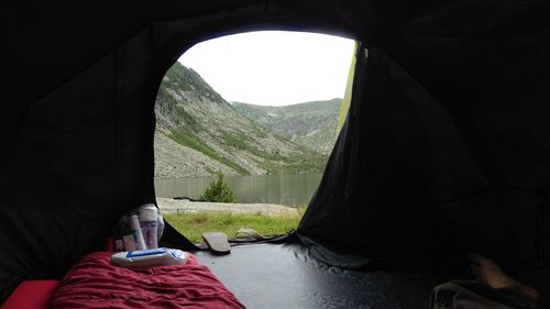 Scenic view of mountains seen through tent