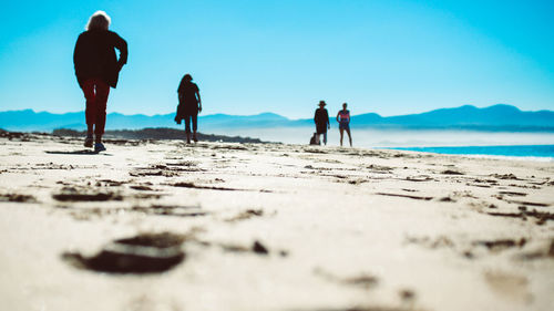 People walking on beach