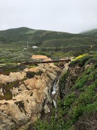 Scenic view of landscape and mountains against sky