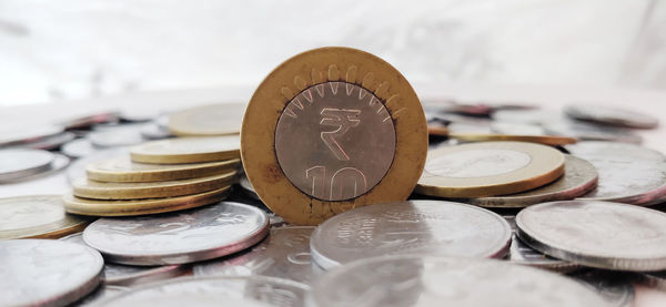 Close-up of coins on table