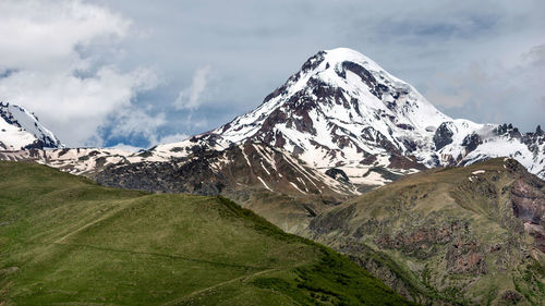 Scenic view of snowcapped mountain against sky