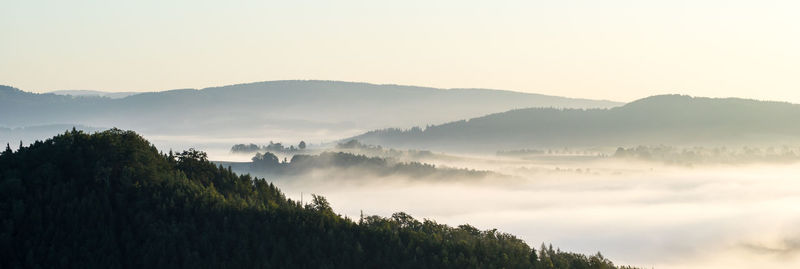 Scenic view of mountains in foggy weather