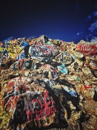 Stack of garbage against blue sky