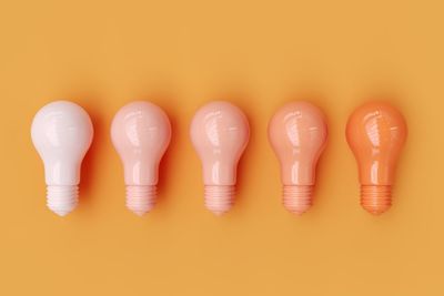 Light bulbs on yellow background