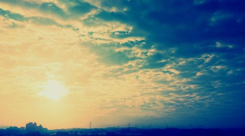 Scenic view of landscape against sky at sunset