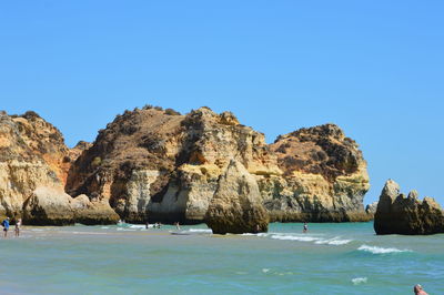 Panoramic view of sea against clear blue sky