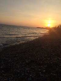 Scenic view of sea against sky during sunset